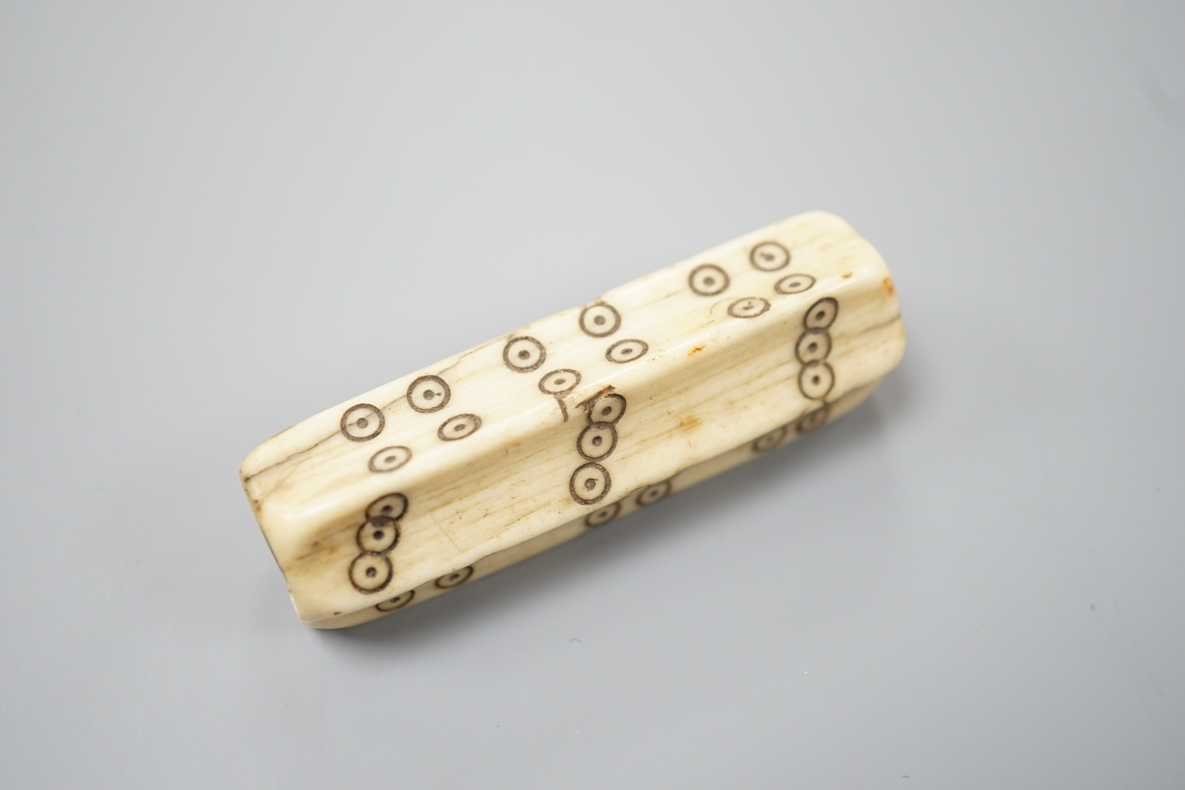 An early European bone six sided long dice, 6.8cm, cf. a similar example in the British Museum No. 1871,0910.2